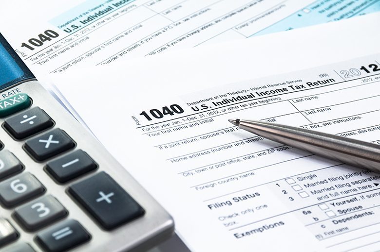 tax form tax form 1040 with calculator in blue tone and desaturated colors