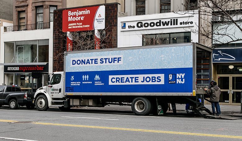 Goodwill truck. New York, January 21, 2017: Two employees are unloading a Goodwill truck is parked in front of their store.